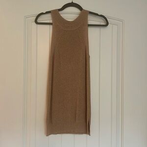 Beige knit sweater tank with high neck and split sides.